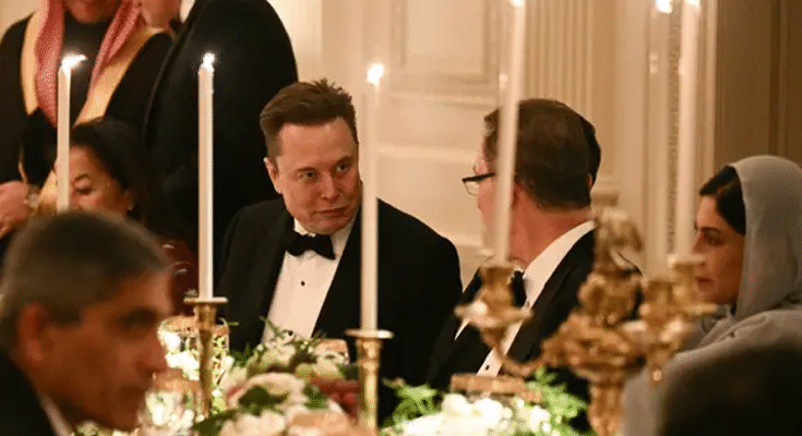 Elon Musk made a high-profile comeback to the White House on Tuesday night, joining a candlelit state dinner hosted by US President Donald Trump in honour of Saudi Crown Prince Mohammed bin Salman — a moment widely viewed as a turning point in their once-bitter feud. It was Musk’s first public appearance in Washington since his clash with Trump earlier this year, a fallout triggered by Musk’s blistering criticism of Trump’s sweeping “Big Beautiful Bill.” The Tesla and SpaceX chief warned the legislation would blow up the national debt, while Trump’s camp accused Musk of protecting his own interests as electric-vehicle incentives were phased out. The dispute escalated into a very public brawl: Trump threatened to yank government contracts from Musk’s companies, wiping out billions in market value as Tesla stock nosedived. Musk, in retaliation, floated the idea of launching a third political force — the “America Party” — though it never took off. Signs of a Thaw Their relationship has been gradually warming since a brief September meeting at conservative activist Charlie Kirk’s memorial. Trump has since struck a conciliatory tone — “I like Elon… I’ve always liked him,” he told reporters — while Musk admitted some of his earlier posts “went too far.” Tuesday night’s dinner cemented that reset. The guest list was a heavyweight mix of global business and political figures: Apple’s Tim Cook, Nvidia’s Jensen Huang, Pfizer’s Albert Bourla, Paramount’s David Ellison, FIFA chief Gianni Infantino and even football icon Cristiano Ronaldo. A Strategic Reconciliation Diplomats and analysts view Musk’s presence as more than symbolic. The Financial Times reported that Musk has quietly resumed support for Republican causes, abandoning talk of a new political party. In return, the Trump administration appears to be reopening doors: Musk ally Jared Isaacman has been renominated to head NASA, and Musk’s AI venture, xAI, is believed to have secured favourable government deals. The timing is especially significant as Trump deepens strategic ties with Saudi Arabia, announcing major agreements spanning F-35 jets, nuclear cooperation and AI. What Musk’s Return Signals For Washington watchers, Tuesday night was a clear message that one of America’s most powerful tech figures is re-entering the centre of political gravity. For Musk, it marks a restored channel to influence national policy. For Trump, it brings an influential billionaire back into his inner orbit at a time of sweeping geopolitical realignment. And for the tech and business worlds, the reunion could reshape everything from AI regulation to space policy in the months ahead.